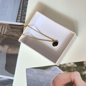 Elegant Gold Necklace with Green Pendant